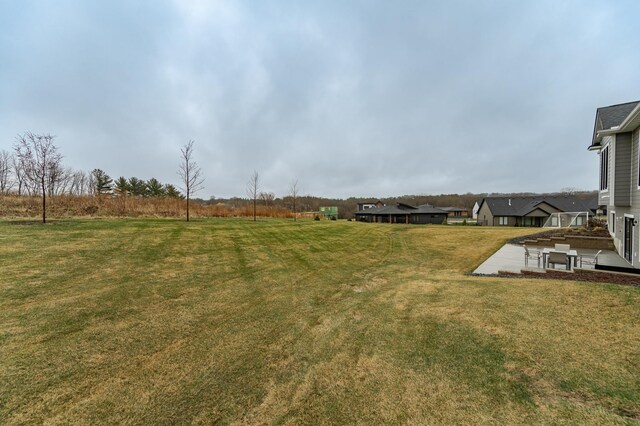 3251 Century Ridge Pl NE, Rochester, MN 55906 - view of green lawn featuring a patio area