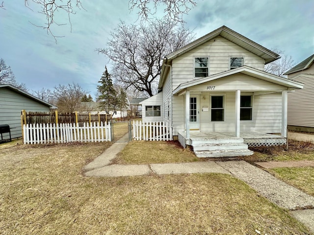 1017 Prairie St, Lake City, MN 55041 - view of front of house with covered porch and fence