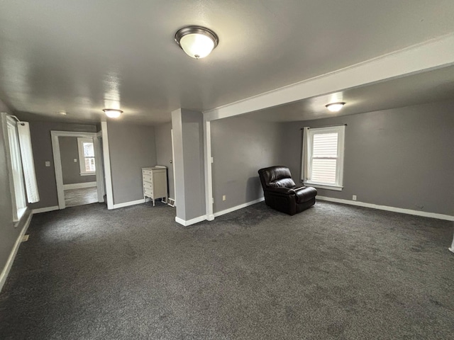 1017 Prairie St, Lake City, MN 55041 - unfurnished room featuring a healthy amount of sunlight, baseboards, and dark carpet