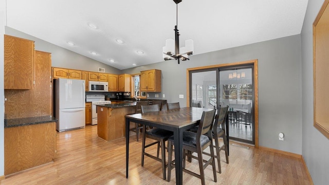dining room with visible vents, lofted ceiling, recessed lighting, a chandelier, and light wood-style flooring
