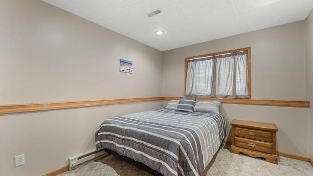 carpeted bedroom with visible vents, a baseboard radiator, baseboards, and recessed lighting