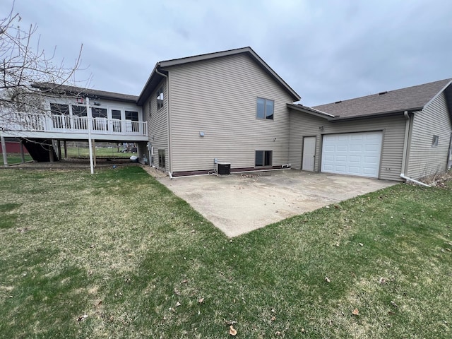rear view of property with a lawn, a deck, a patio area, and central air condition unit