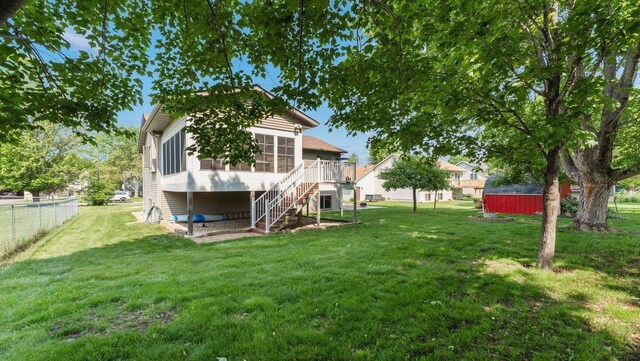 328 5th Ave S, Sartell, MN 56377 - view of yard featuring stairs and a sunroom