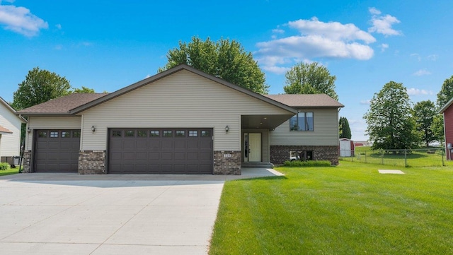 328 5th Ave S, Sartell, MN 56377 - view of front of property featuring a garage, brick siding, and concrete driveway