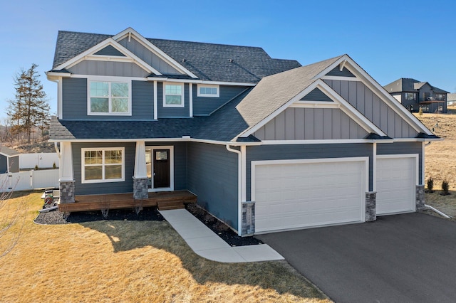 27290 Petes Hill Trl, Elko New Market, MN 55020 - craftsman-style house featuring board and batten siding, aphalt driveway, a garage, fence, and a shingled roof