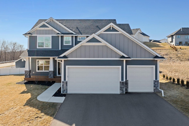27290 Petes Hill Trl, Elko New Market, MN 55020 - craftsman inspired home featuring roof with shingles, driveway, board and batten siding, stone siding, and an attached garage