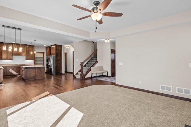 27290 Petes Hill Trl, Elko New Market, MN 55020 - unfurnished living room with stairway, visible vents, baseboards, and a ceiling fan