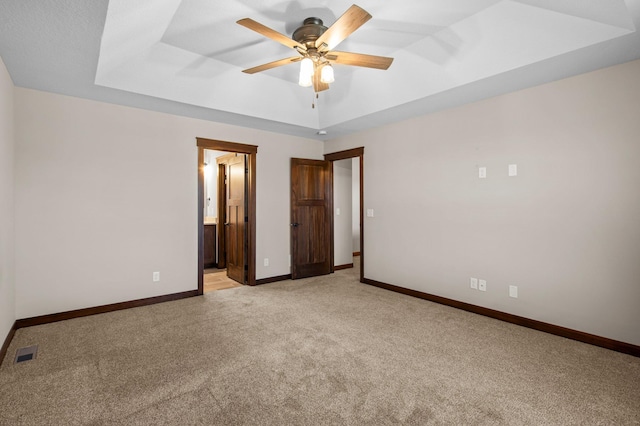 27290 Petes Hill Trl, Elko New Market, MN 55020 - unfurnished bedroom featuring visible vents, baseboards, a raised ceiling, and light colored carpet