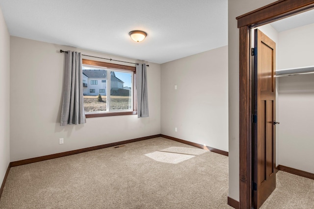 27290 Petes Hill Trl, Elko New Market, MN 55020 - unfurnished bedroom featuring visible vents, baseboards, a closet, and carpet