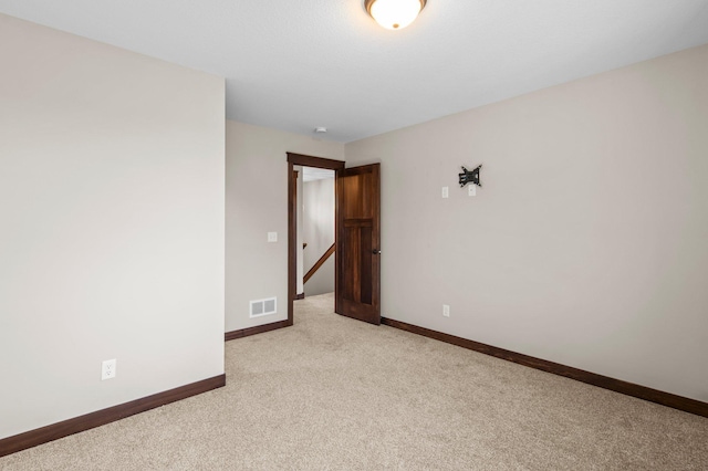 27290 Petes Hill Trl, Elko New Market, MN 55020 - unfurnished room with light carpet, visible vents, and baseboards