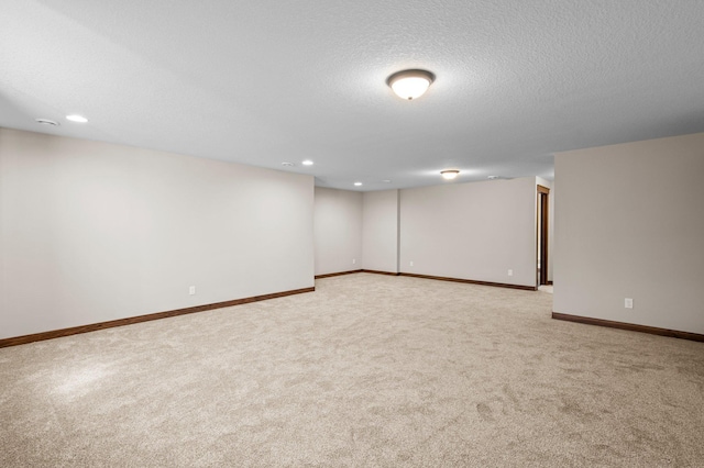 27290 Petes Hill Trl, Elko New Market, MN 55020 - finished below grade area featuring a textured ceiling, light colored carpet, baseboards, and recessed lighting