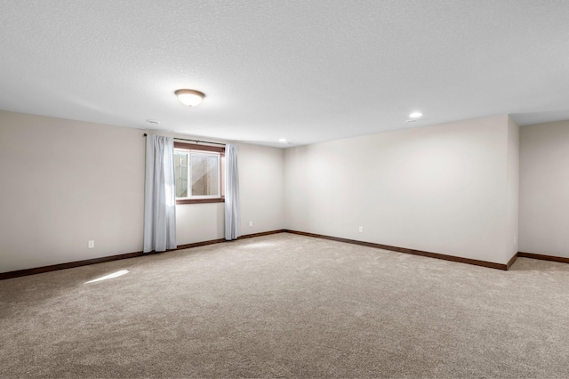 27290 Petes Hill Trl, Elko New Market, MN 55020 - unfurnished room with baseboards, recessed lighting, light colored carpet, and a textured ceiling