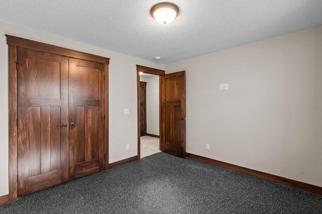 27290 Petes Hill Trl, Elko New Market, MN 55020 - unfurnished bedroom featuring baseboards, carpet, and a textured ceiling