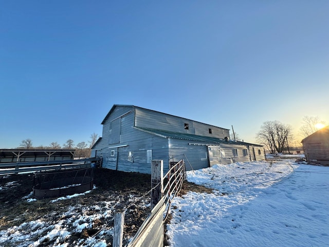 43091 Co Highway 75, Wadena, MN 56482 - view of snowy exterior with fence, a barn, and an outbuilding
