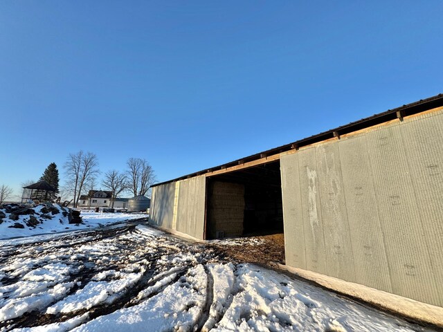 43091 Co Highway 75, Wadena, MN 56482 - snow covered structure featuring an outbuilding and an outdoor structure