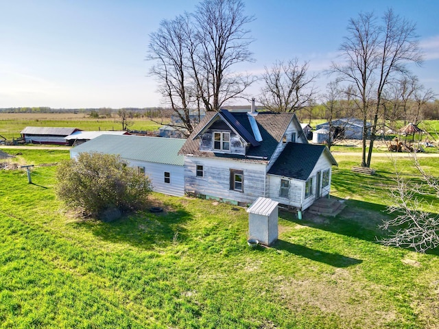 43091 Co Highway 75, Wadena, MN 56482 - back of house with a chimney and a yard