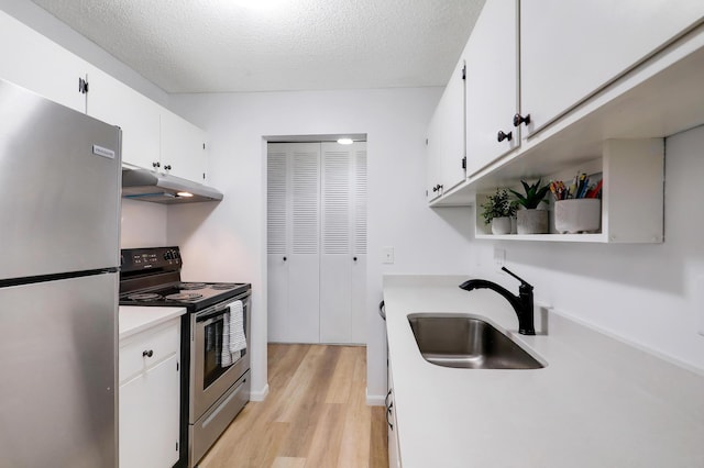 2800 Hillsboro Ave N Unit 220, New Hope, MN 55427 - kitchen with stainless steel appliances, under cabinet range hood, light wood finished floors, light countertops, and white cabinets
