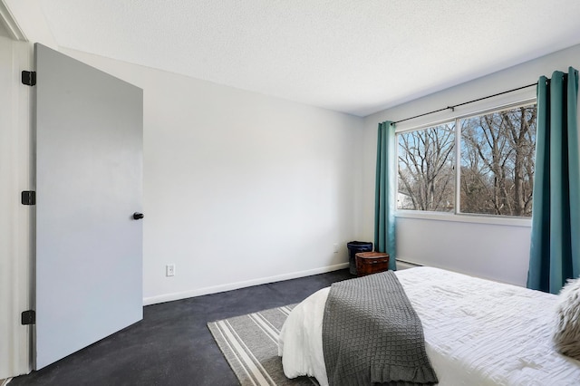 2800 Hillsboro Ave N Unit 220, New Hope, MN 55427 - bedroom featuring a textured ceiling and baseboards