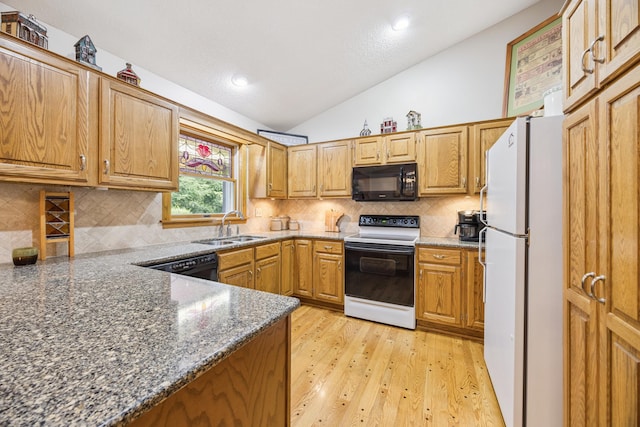 5475 Oakgreen Pl N, Oak Park Heights, MN 55082 - kitchen with black appliances, vaulted ceiling, backsplash, light wood-type flooring, and dark stone countertops