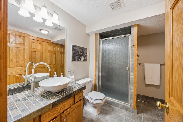 5475 Oakgreen Pl N, Oak Park Heights, MN 55082 - bathroom with a shower stall, vanity, and a textured ceiling