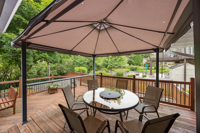 5475 Oakgreen Pl N, Oak Park Heights, MN 55082 - deck featuring a storage unit, a gazebo, and outdoor dining area