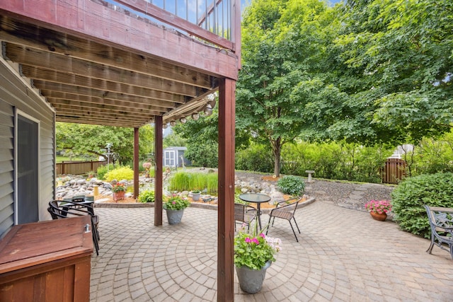 5475 Oakgreen Pl N, Oak Park Heights, MN 55082 - view of patio with a shed and outdoor dining area