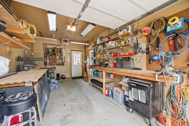 5475 Oakgreen Pl N, Oak Park Heights, MN 55082 - garage with a workshop area and a garage door opener