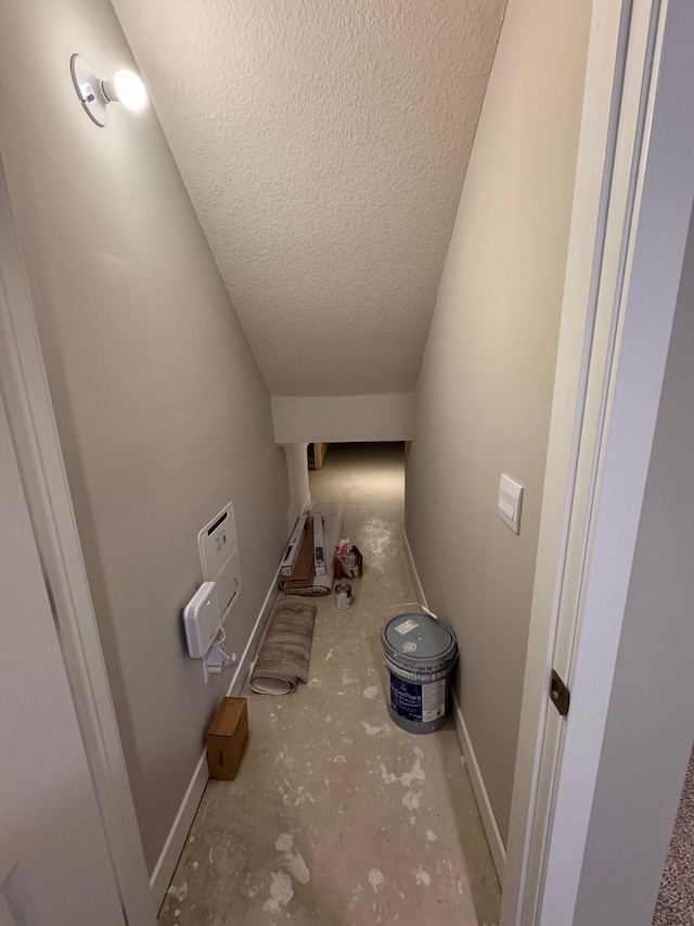 9829 89th St S, Cottage Grove, MN 55016 - corridor featuring a textured ceiling and baseboards