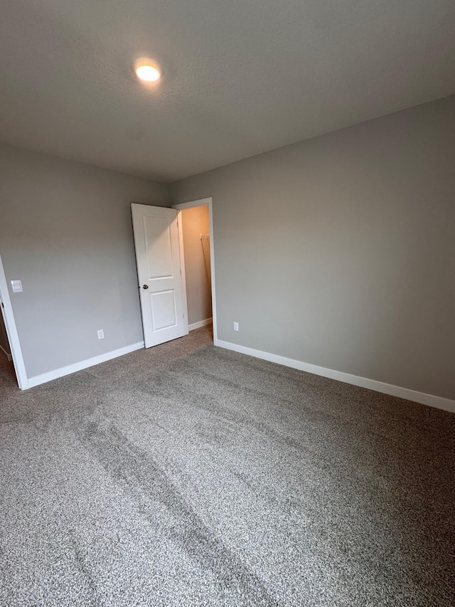 9829 89th St S, Cottage Grove, MN 55016 - carpeted empty room featuring baseboards