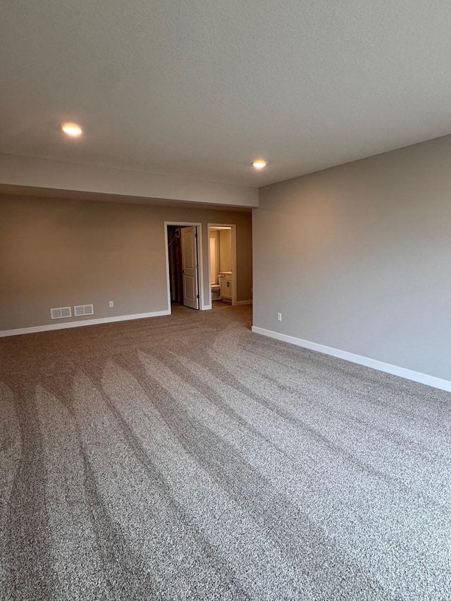 9829 89th St S, Cottage Grove, MN 55016 - carpeted empty room featuring recessed lighting, baseboards, and a textured ceiling