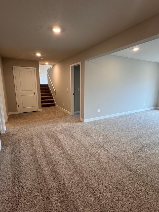 9829 89th St S, Cottage Grove, MN 55016 - finished below grade area featuring stairs, light colored carpet, baseboards, and recessed lighting