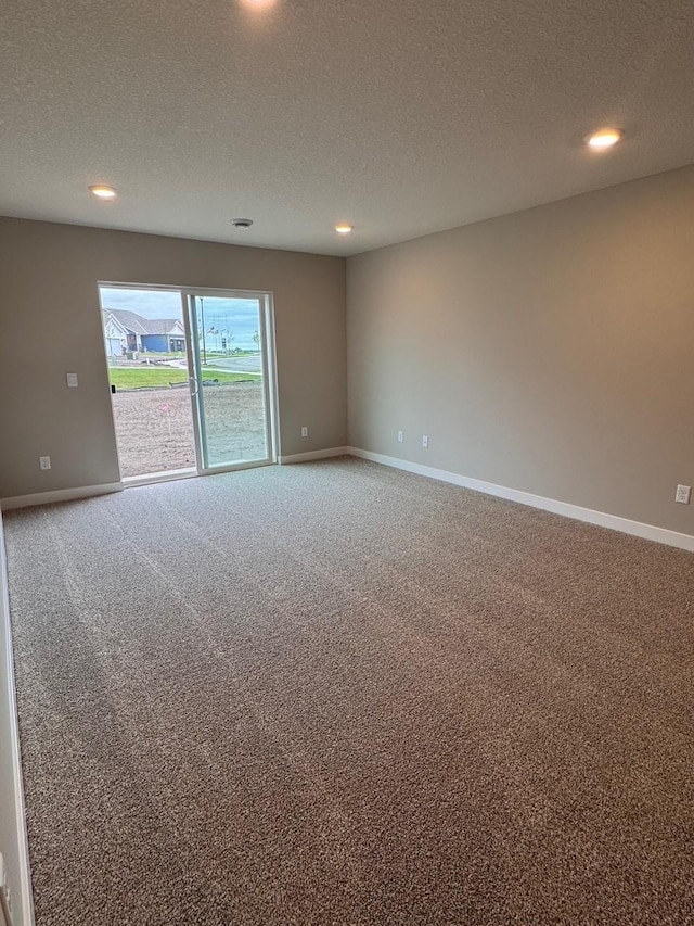 9829 89th St S, Cottage Grove, MN 55016 - empty room featuring carpet flooring, a textured ceiling, recessed lighting, and baseboards