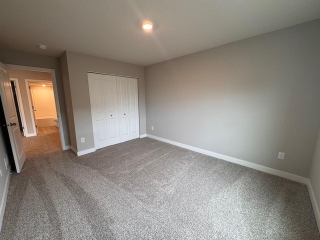 9829 89th St S, Cottage Grove, MN 55016 - unfurnished bedroom featuring a closet, baseboards, and carpet