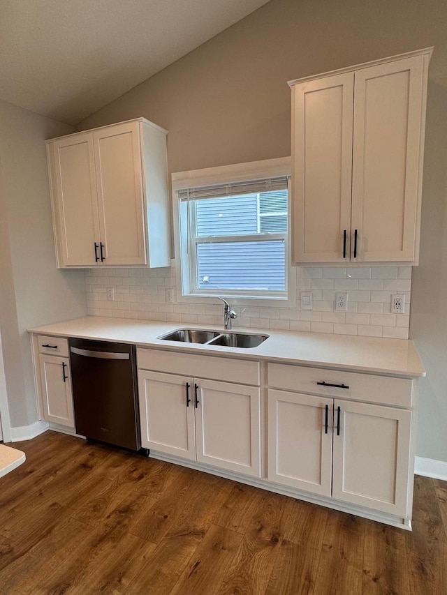 9829 89th St S, Cottage Grove, MN 55016 - kitchen with dishwasher, a sink, lofted ceiling, tasteful backsplash, and white cabinets