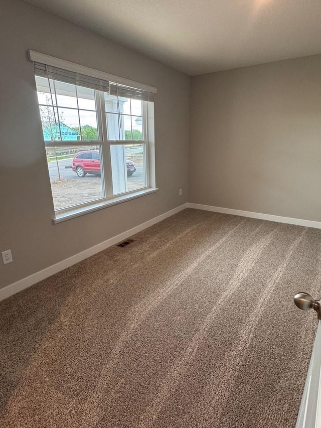9829 89th St S, Cottage Grove, MN 55016 - carpeted empty room featuring baseboards