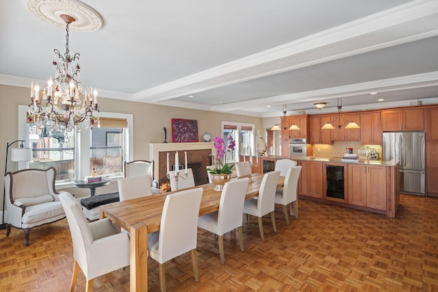 dining space with beverage cooler, beamed ceiling, a chandelier, and a healthy amount of sunlight