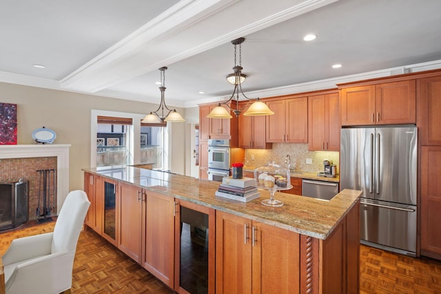 kitchen with backsplash, a center island, light stone countertops, beverage cooler, and stainless steel appliances