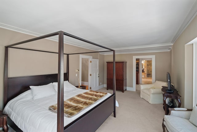bedroom with ornamental molding and light colored carpet