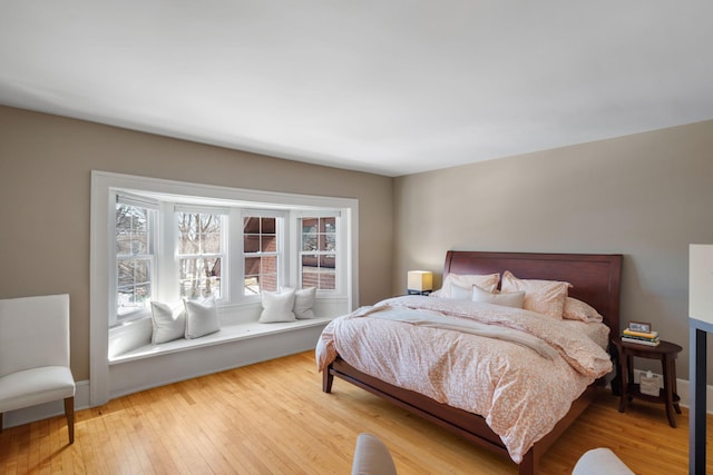 bedroom with light wood-type flooring