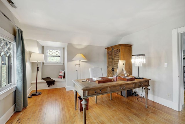 office featuring light wood-type flooring, baseboards, and visible vents