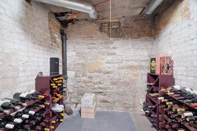 wine cellar with unfinished concrete flooring