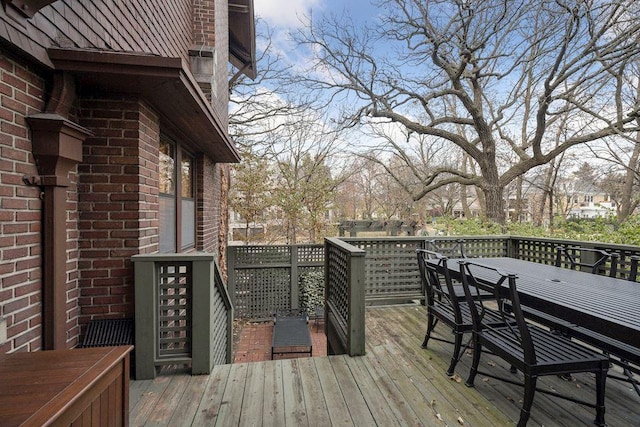 wooden terrace featuring outdoor dining space