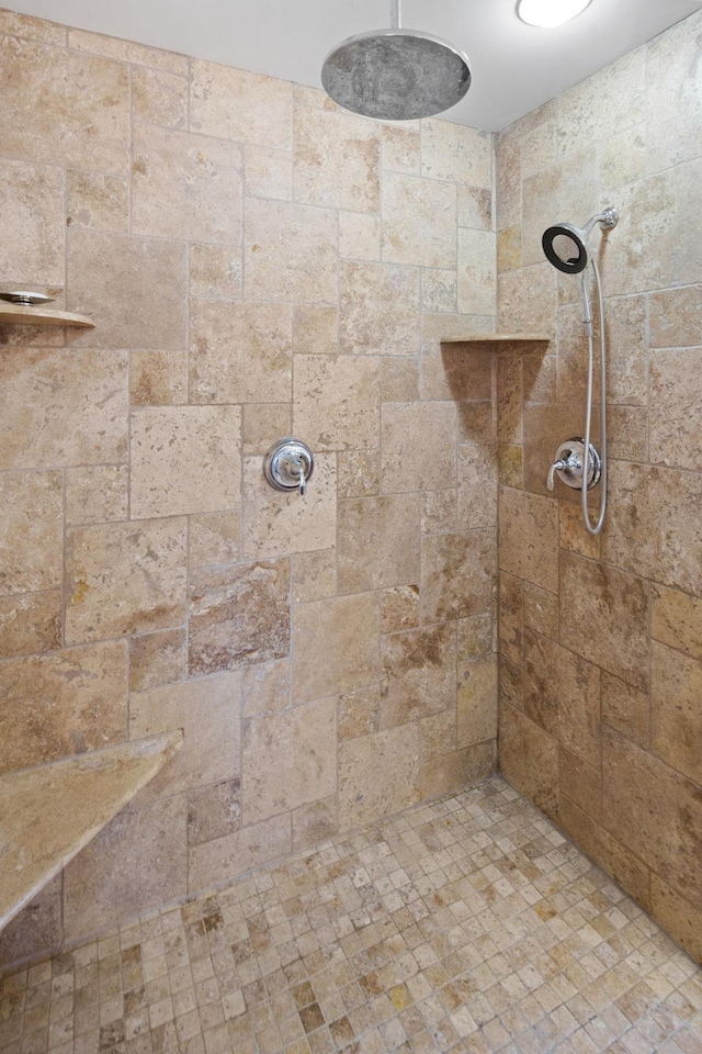 full bath featuring tiled shower