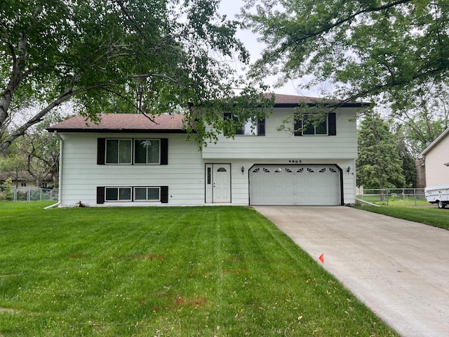 9805 Jackson St NE, Blaine, MN 55434 - split level home with a garage and driveway