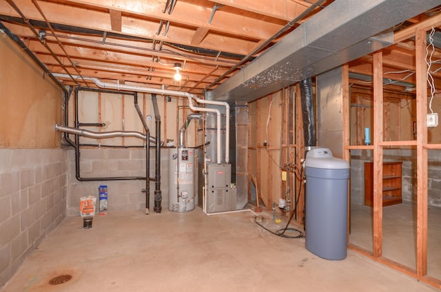 9805 Jackson St NE, Blaine, MN 55434 - unfinished basement featuring gas water heater, heating unit, and a water softener