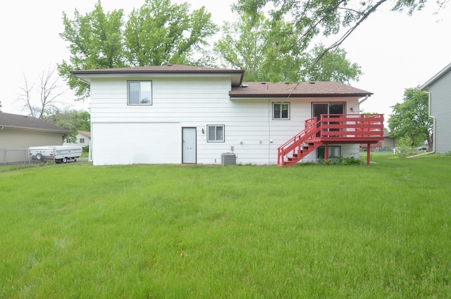 9805 Jackson St NE, Blaine, MN 55434 - rear view of house with stairs, a deck, a lawn, and central AC unit