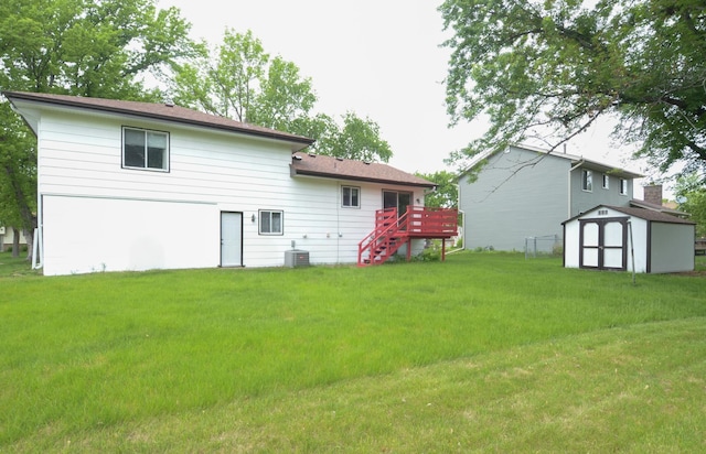 9805 Jackson St NE, Blaine, MN 55434 - rear view of property featuring a deck, a lawn, stairway, and central air condition unit