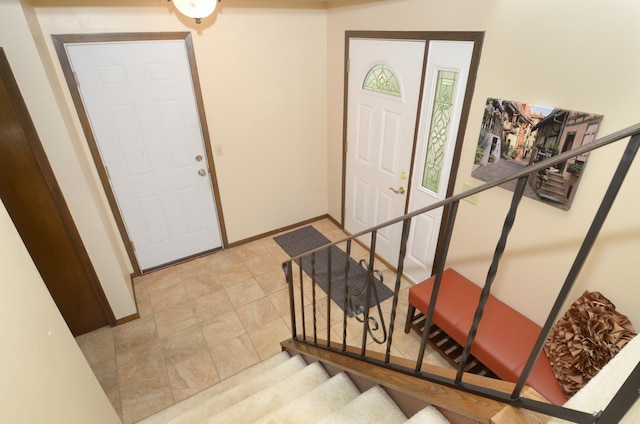 9805 Jackson St NE, Blaine, MN 55434 - foyer with baseboards and stairway