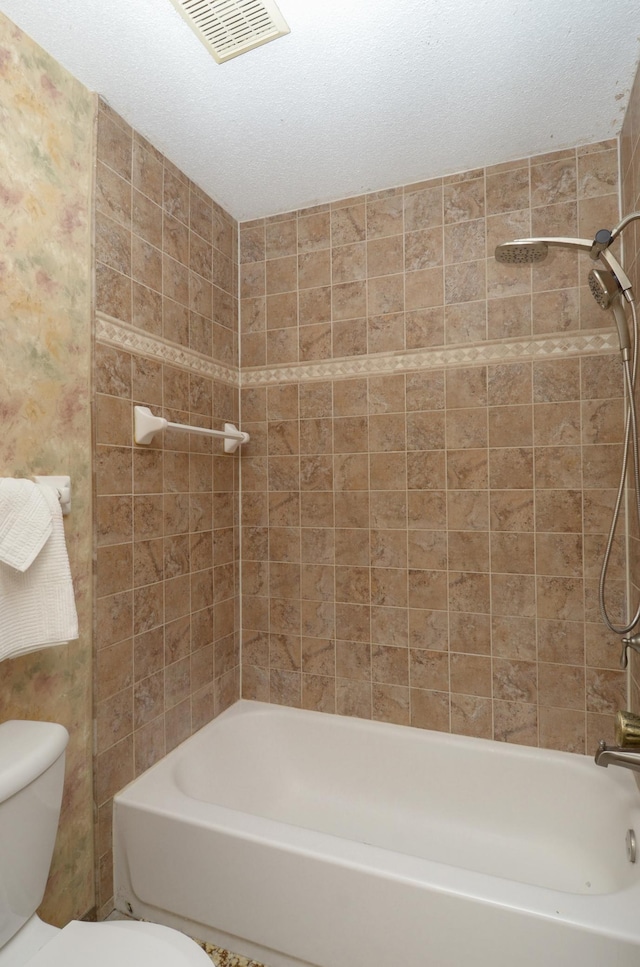 9805 Jackson St NE, Blaine, MN 55434 - bathroom featuring toilet and shower / bathtub combination