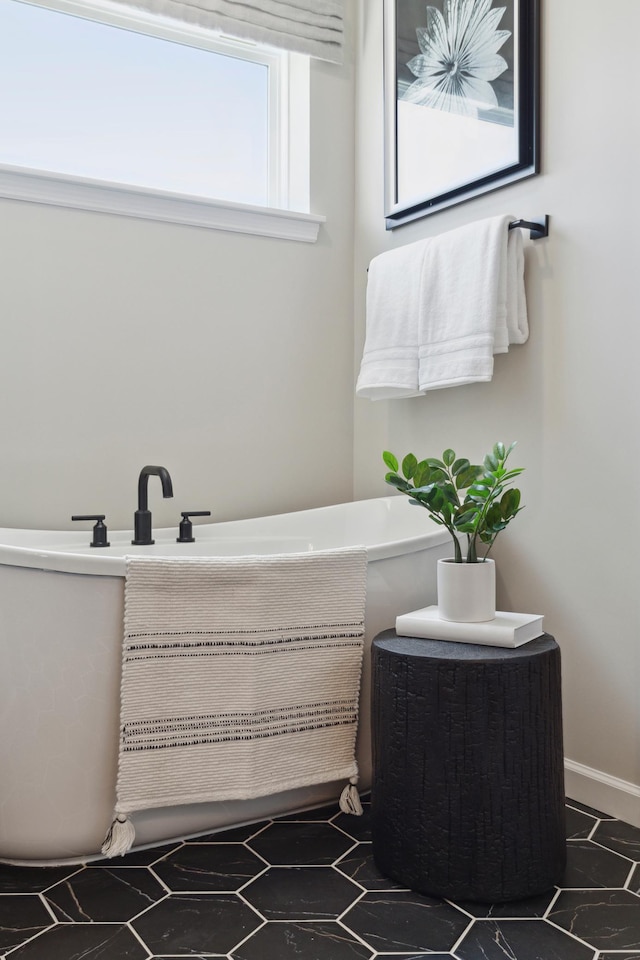 bathroom with a freestanding bath